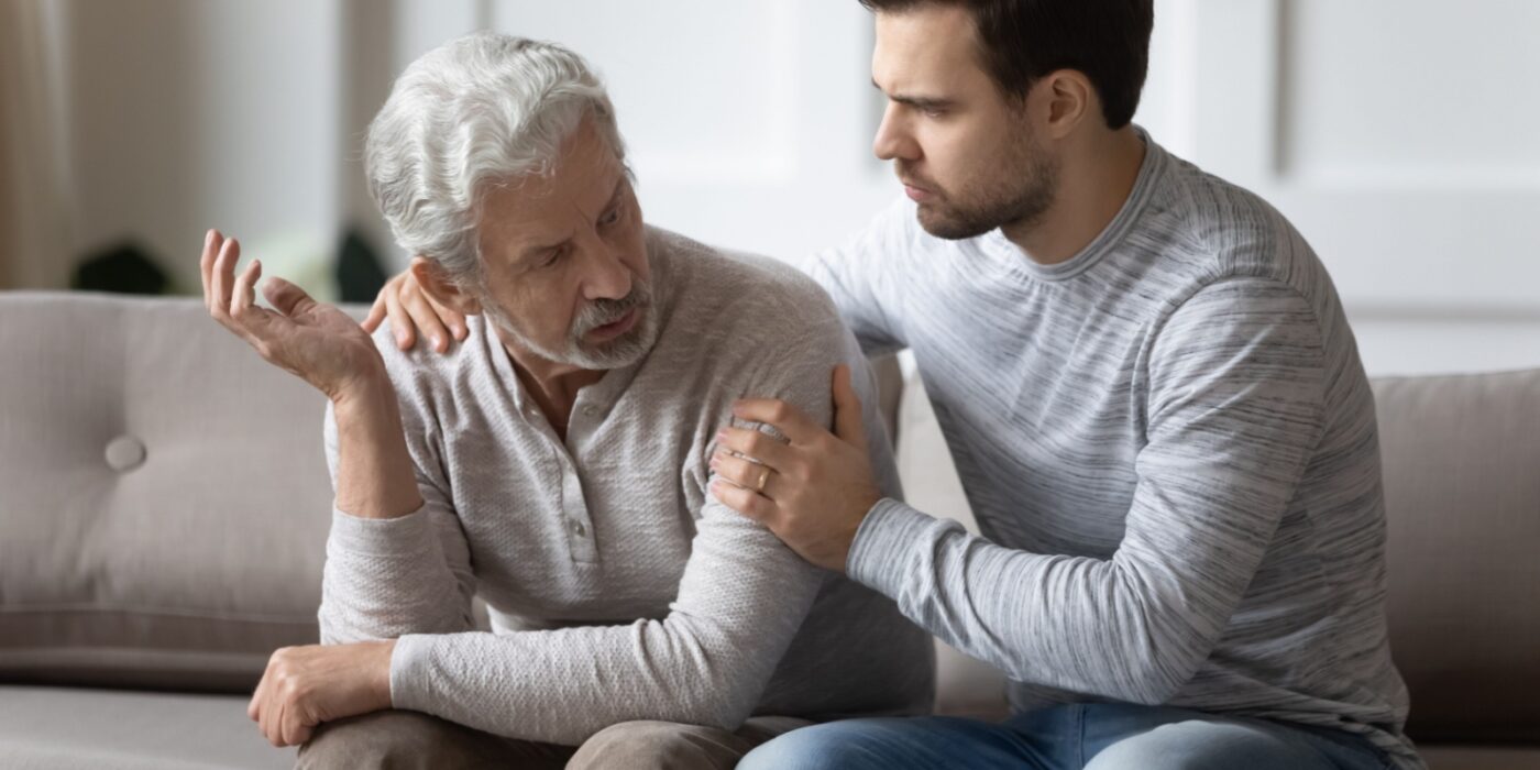 An adult child talking to their mature parent about transitioning to community living.