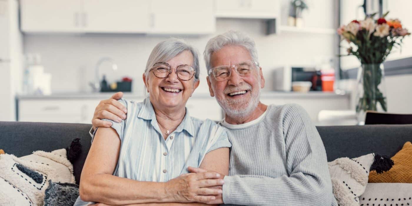 Senior couple enjoying a happy moment together in an assisted living community.