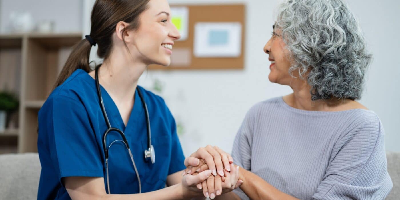 A senior woman getting a regular checkup with her female doctor.