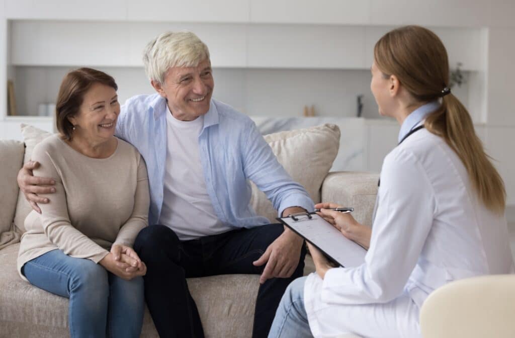 A senior couple chats with a doctor about a new dementia diagnosis and what that could mean for memory care support