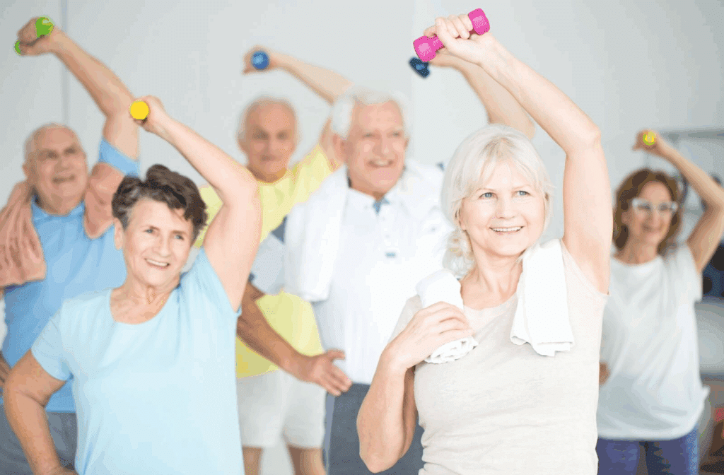 A group of seniors participate in a group fitness class run by their assisted living community.