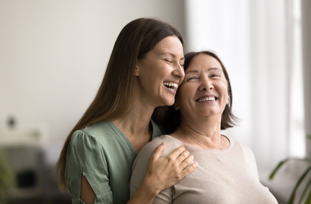 Mother and daughter smiling together, relieved to have decided on an assisted living community in Minnesota.