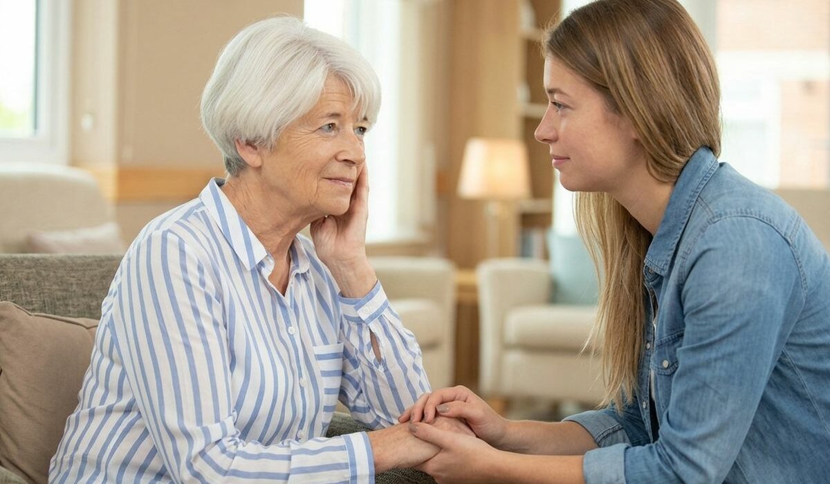 Caring adult reviewing memory care options with a loved one at a warm, welcoming senior living community in Minnesota.
